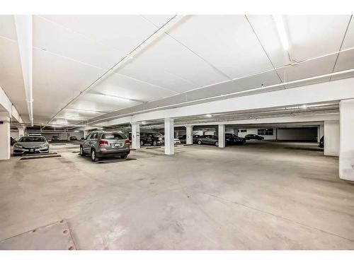 1315-8880 Horton Road Sw, Calgary, AB - Indoor Photo Showing Garage