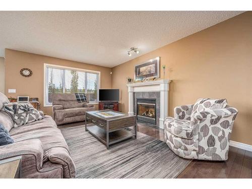 130 Evansmeade Close Nw, Calgary, AB - Indoor Photo Showing Living Room With Fireplace