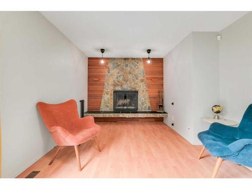 203 Deer Ridge Way Se, Calgary, AB - Indoor Photo Showing Living Room With Fireplace