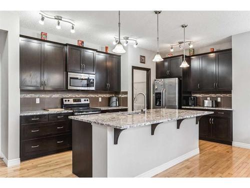 12 Cranberry Gardens Se, Calgary, AB - Indoor Photo Showing Kitchen With Stainless Steel Kitchen With Upgraded Kitchen