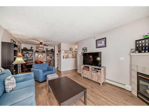 1410-6224 17 Avenue Se, Calgary, AB - Indoor Photo Showing Living Room With Fireplace