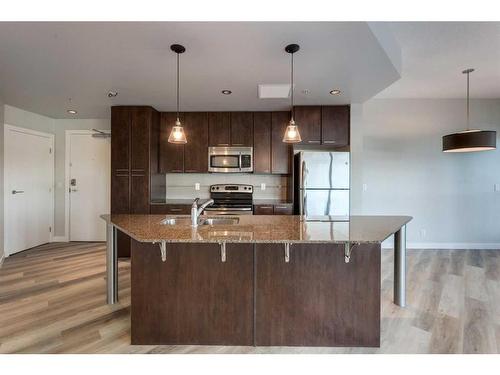 305-220 12 Avenue Se, Calgary, AB - Indoor Photo Showing Kitchen With Upgraded Kitchen