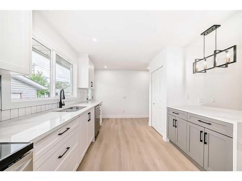 6739 3 Avenue Se, Calgary, AB - Indoor Photo Showing Kitchen With Double Sink