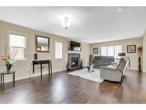 108 Saddlecrest Gardens Ne, Calgary, AB - Indoor Photo Showing Living Room With Fireplace