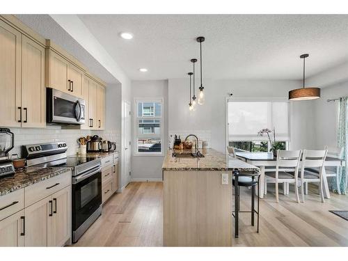 115-40 Carrington Plaza Nw, Calgary, AB - Indoor Photo Showing Kitchen With Upgraded Kitchen