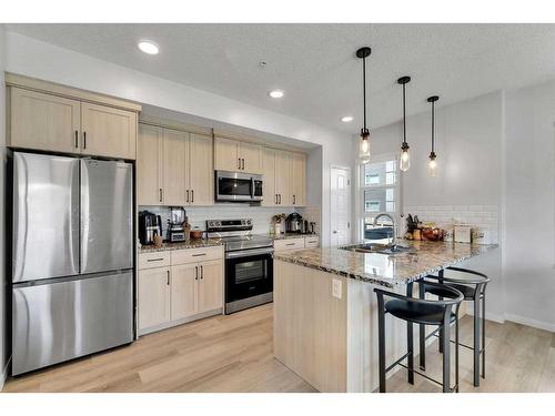 115-40 Carrington Plaza Nw, Calgary, AB - Indoor Photo Showing Kitchen With Upgraded Kitchen