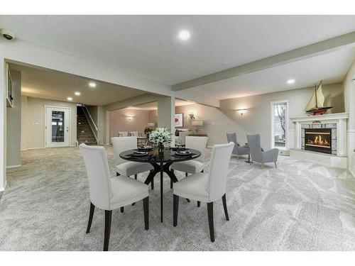 692 West Chestermere Drive, Chestermere, AB - Indoor Photo Showing Dining Room With Fireplace