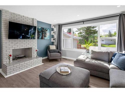 172 Brabourne Road Sw, Calgary, AB - Indoor Photo Showing Living Room With Fireplace