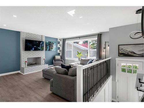 172 Brabourne Road Sw, Calgary, AB - Indoor Photo Showing Other Room With Fireplace