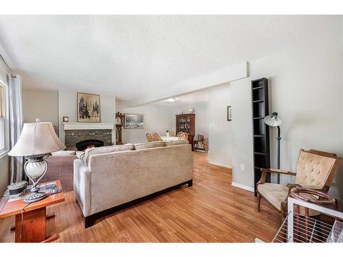 14 Knight Street, Okotoks, AB - Indoor Photo Showing Living Room With Fireplace