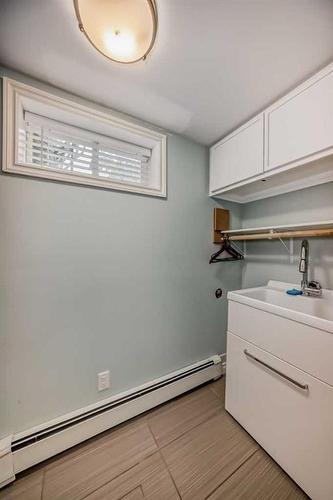 48 Hooke Road Sw, Calgary, AB - Indoor Photo Showing Laundry Room