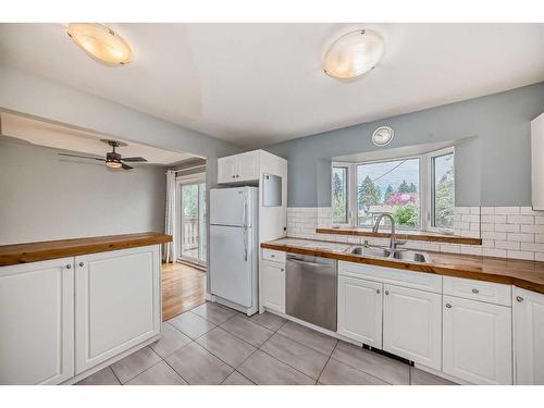 48 Hooke Road Sw, Calgary, AB - Indoor Photo Showing Kitchen With Double Sink
