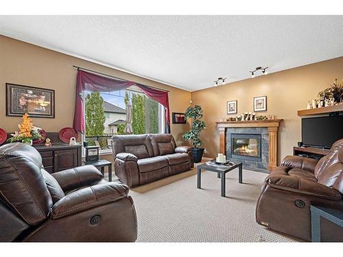 137 Lavender Link, Chestermere, AB - Indoor Photo Showing Living Room With Fireplace