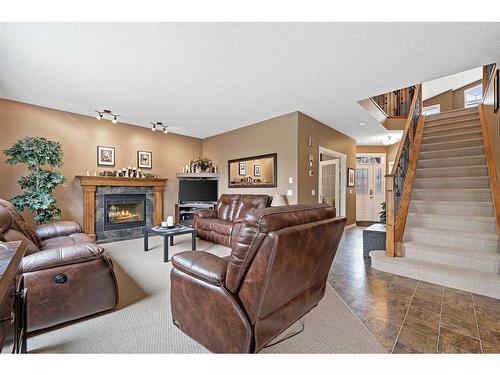 137 Lavender Link, Chestermere, AB - Indoor Photo Showing Living Room With Fireplace