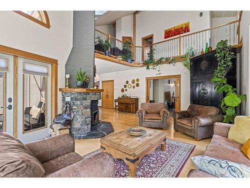 265 Three Sister Drive Se, Canmore, AB - Indoor Photo Showing Living Room With Fireplace