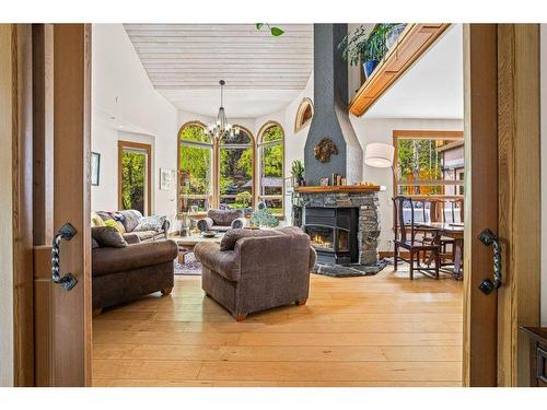 265 Three Sister Drive Se, Canmore, AB - Indoor Photo Showing Living Room With Fireplace