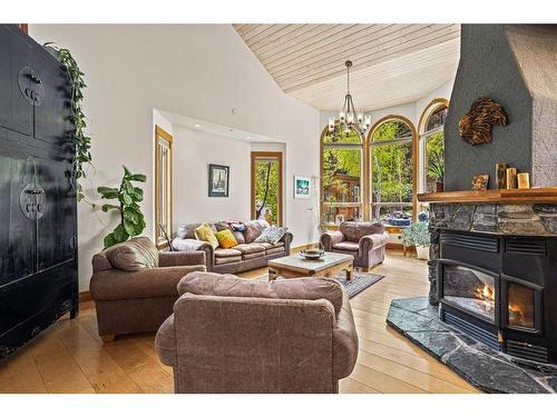 265 Three Sister Drive Se, Canmore, AB - Indoor Photo Showing Living Room With Fireplace