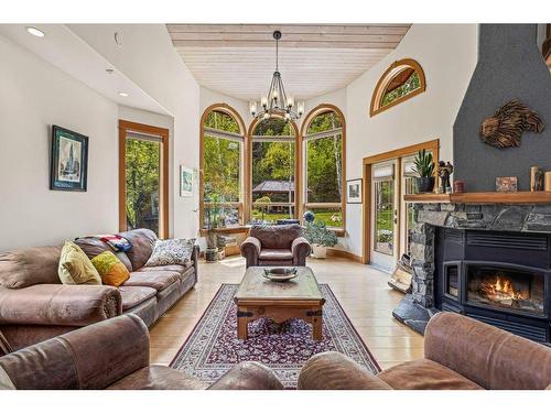 265 Three Sister Drive Se, Canmore, AB - Indoor Photo Showing Living Room With Fireplace