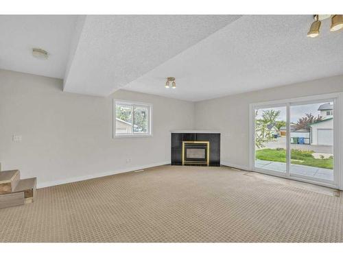 12 Martin Crossing Rise Ne, Calgary, AB - Indoor Photo Showing Living Room With Fireplace