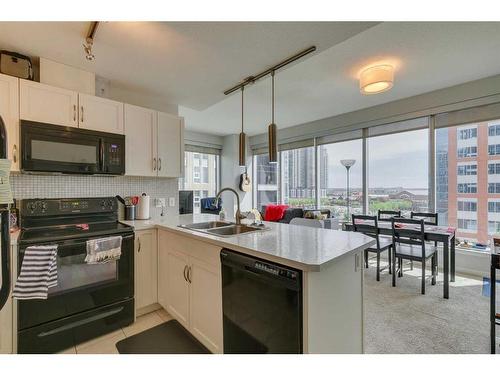 509-1320 1 Street Se, Calgary, AB - Indoor Photo Showing Kitchen With Double Sink