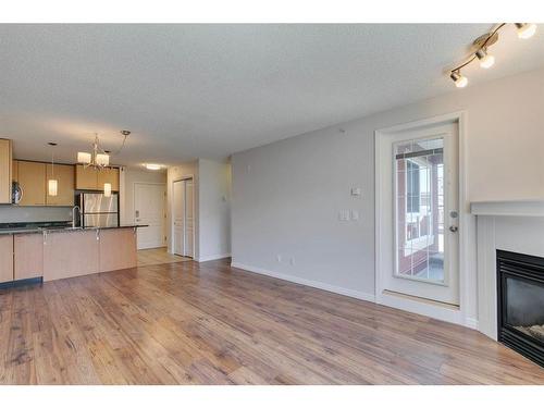 425-22 Richard Place Sw, Calgary, AB - Indoor With Fireplace