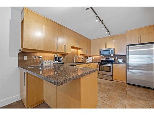 104-350 4 Avenue Ne, Calgary, AB - Indoor Photo Showing Kitchen With Stainless Steel Kitchen