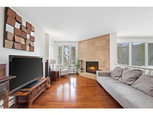 104-350 4 Avenue Ne, Calgary, AB - Indoor Photo Showing Living Room With Fireplace