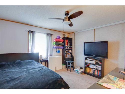 353 Spring Haven Court Se, Airdrie, AB - Indoor Photo Showing Bedroom