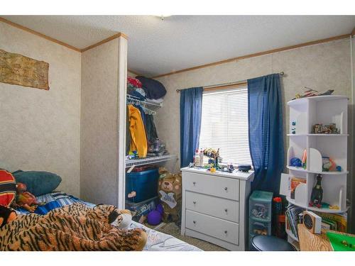 353 Spring Haven Court Se, Airdrie, AB - Indoor Photo Showing Bedroom