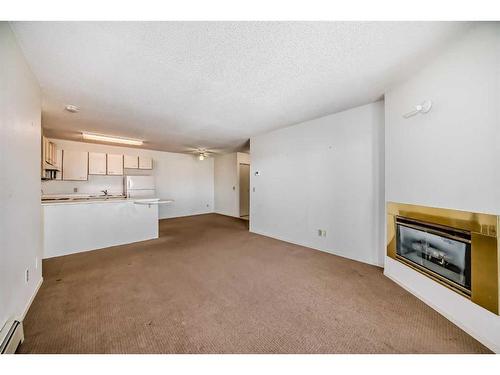 32-3000 Edenwold Heights Nw, Calgary, AB - Indoor With Fireplace