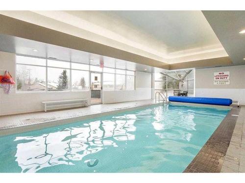 32-3000 Edenwold Heights Nw, Calgary, AB - Indoor Photo Showing Other Room With In Ground Pool