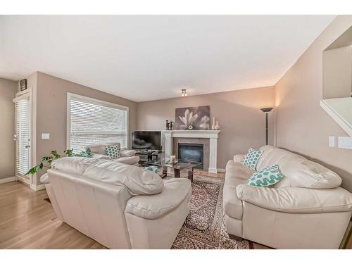 32 Bridlecrest Court Sw, Calgary, AB - Indoor Photo Showing Living Room With Fireplace