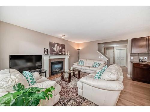 32 Bridlecrest Court Sw, Calgary, AB - Indoor Photo Showing Living Room With Fireplace