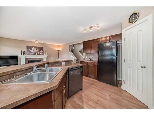 32 Bridlecrest Court Sw, Calgary, AB - Indoor Photo Showing Kitchen With Double Sink