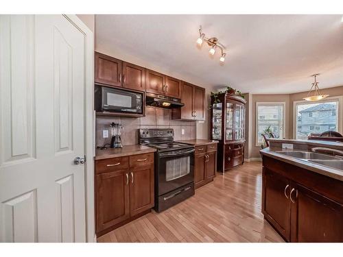 32 Bridlecrest Court Sw, Calgary, AB - Indoor Photo Showing Kitchen With Double Sink