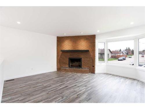 1807 Summerfield Boulevard Se, Airdrie, AB - Indoor Photo Showing Living Room With Fireplace