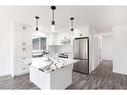 1807 Summerfield Boulevard Se, Airdrie, AB  - Indoor Photo Showing Kitchen With Upgraded Kitchen 