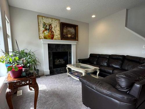 956 Prestwick Circle Se, Calgary, AB - Indoor Photo Showing Living Room With Fireplace