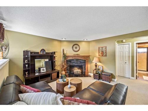252 Woodridge Drive Sw, Calgary, AB - Indoor Photo Showing Living Room With Fireplace
