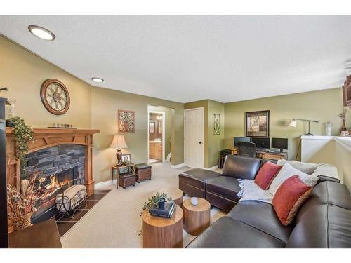 252 Woodridge Drive Sw, Calgary, AB - Indoor Photo Showing Living Room With Fireplace