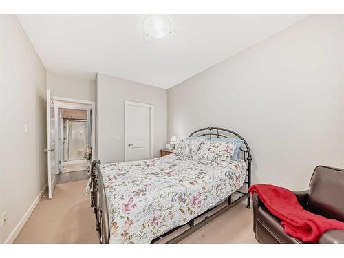 117-205 Sunset Drive, Cochrane, AB - Indoor Photo Showing Bedroom