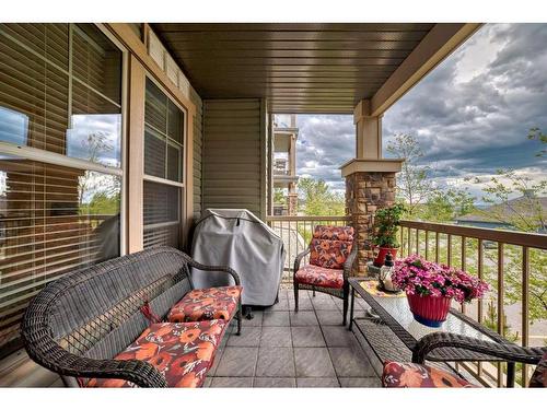 117-205 Sunset Drive, Cochrane, AB - Outdoor With Deck Patio Veranda With Exterior