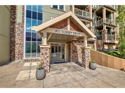 117-205 Sunset Drive, Cochrane, AB - Outdoor With Balcony