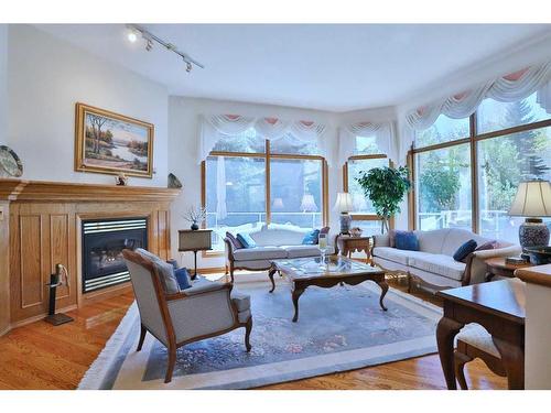 72 Hamptons Drive Nw, Calgary, AB - Indoor Photo Showing Living Room With Fireplace