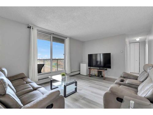 1502-4944 Dalton Drive Nw, Calgary, AB - Indoor Photo Showing Living Room