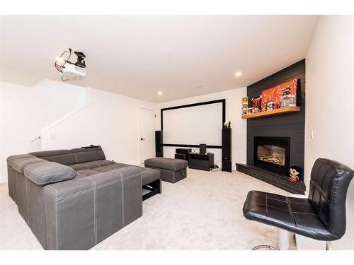 2 Prestwick Rise Se, Calgary, AB - Indoor Photo Showing Other Room With Fireplace