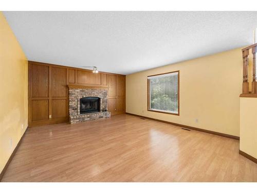 127 Shawnessy Drive, Calgary, AB - Indoor Photo Showing Living Room With Fireplace