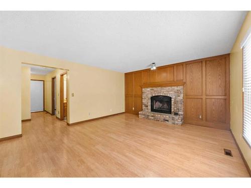 127 Shawnessy Drive, Calgary, AB - Indoor Photo Showing Living Room With Fireplace
