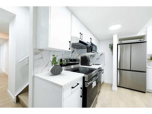 203 Lucas Close Nw, Calgary, AB - Indoor Photo Showing Kitchen With Stainless Steel Kitchen