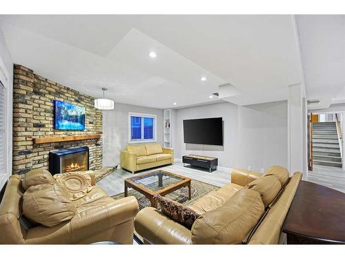 19 Hawkslow Bay Nw, Calgary, AB - Indoor Photo Showing Living Room With Fireplace